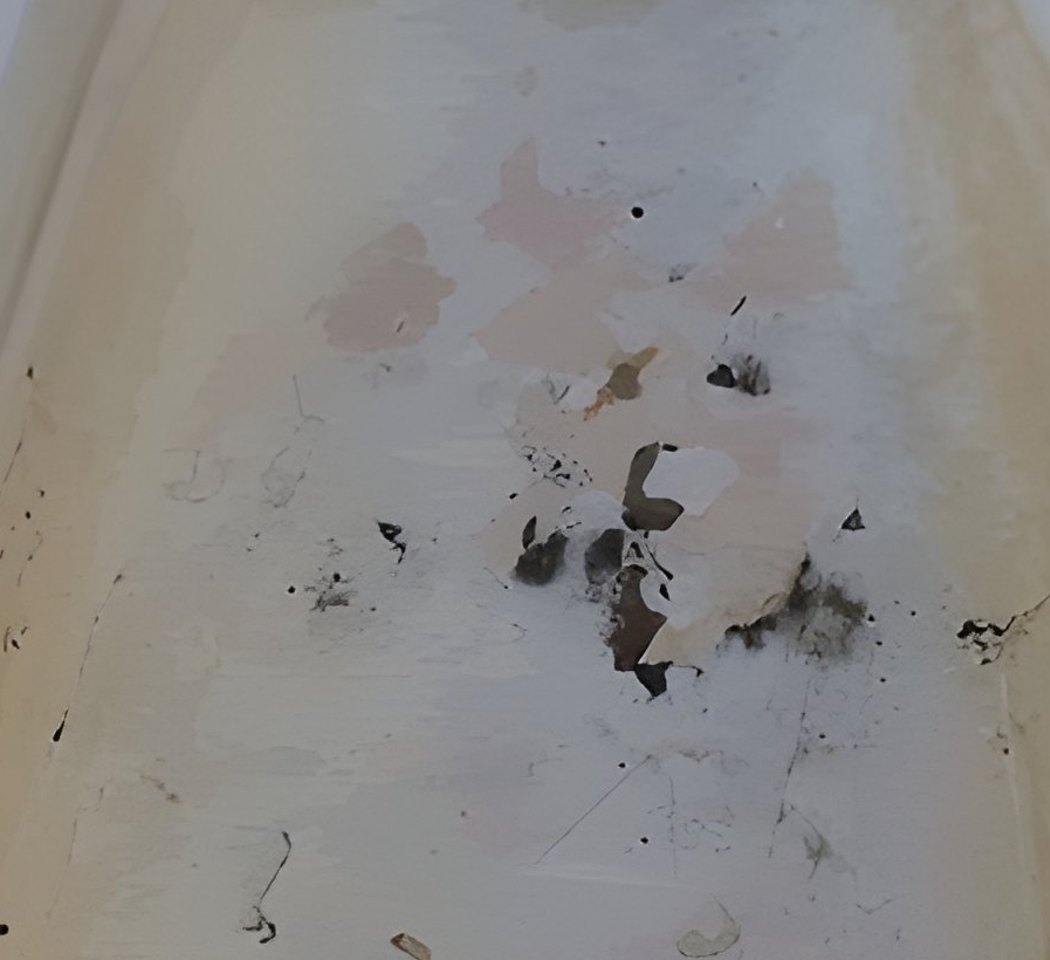 Waterslide flume before restoration — stained and worn surface